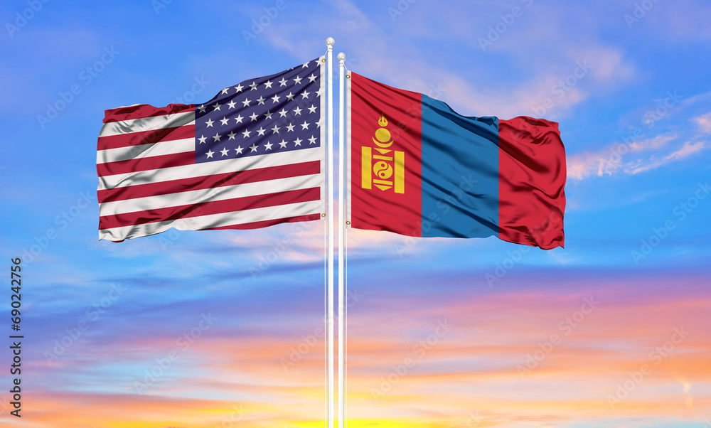 United States and Mongolia two flags on flagpoles and blue cloudy sky . Diplomacy concept, international relations