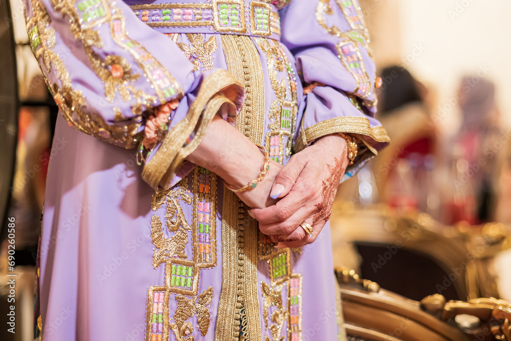 A beautiful woman wears a traditional Moroccan dress