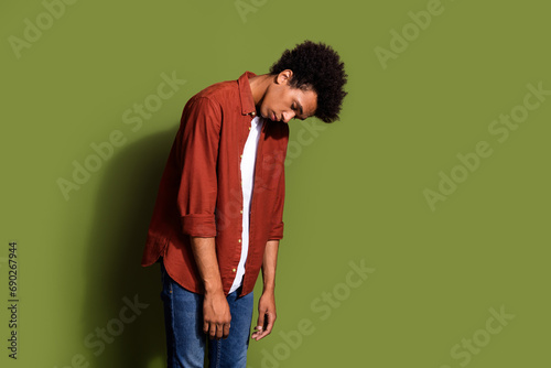 Photo portrait of handsome young guy bend tired unhappy dressed stylish brown outfit isolated on khaki color background © deagreez