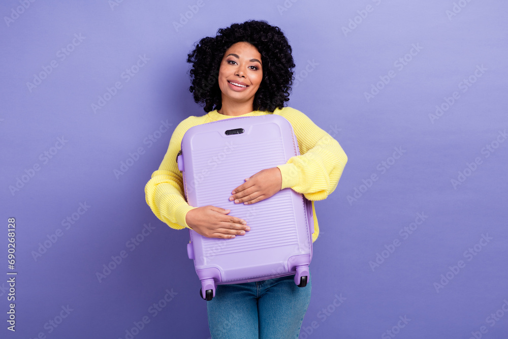 Portrait of good mood person with chevelure wear knit pullover hold baggage prepare for vacation isolated on purple color background Portrait of good mood person with chevelure wear knit pullover hold baggage prepare for vacation isolated on purple color background