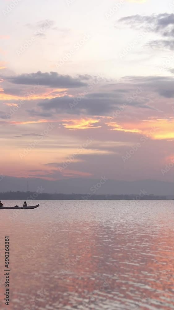 Vertical video of Fisherman Silhouette on His Boat Vertical video of Fisherman Silhouette on His Boat