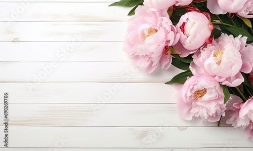 Bouquet of peonies on a white wooden table