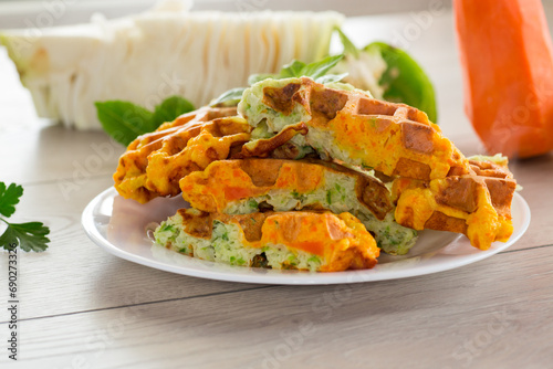 cooked two-color vegetable waffles made from cabbage and carrots.