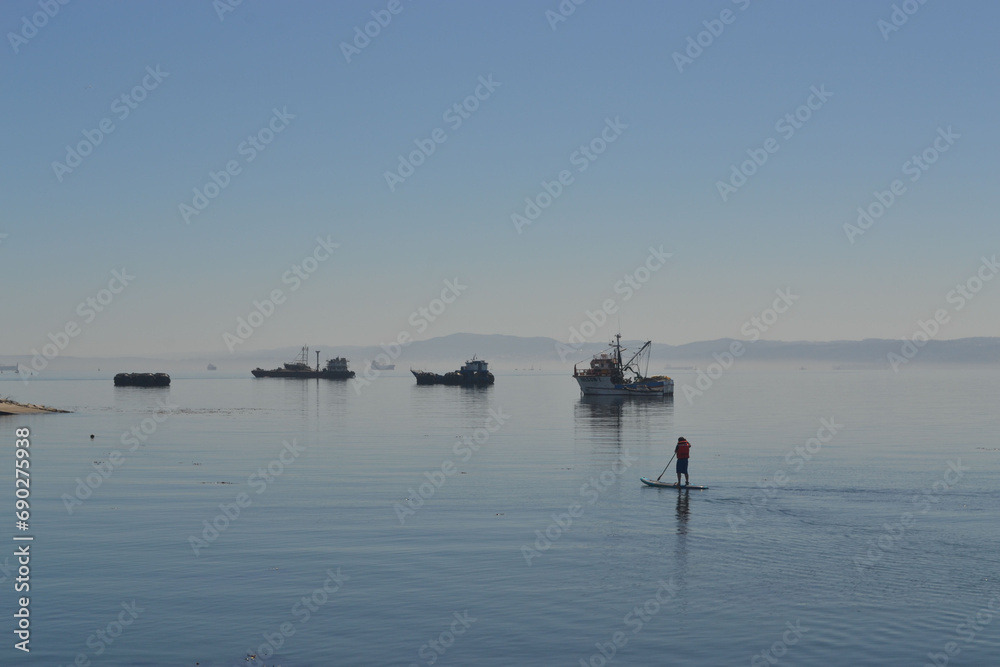 doing paddle board in the pacific ocean in Chile doing paddle board in the pacific ocean in Chile