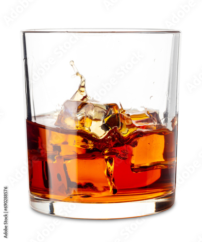 Cuadro en lienzo Glass of whiskey or bourbon with splashing of ice cubes falling , Whiskey on the