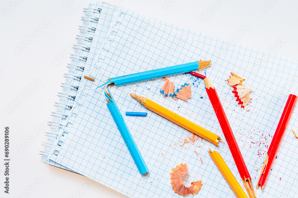A notebook with pencils and crayons on it. A Colorful Notebook with Pencils and Crayons A notebook with pencils and crayons on it. A Colorful Notebook with Pencils and Crayons