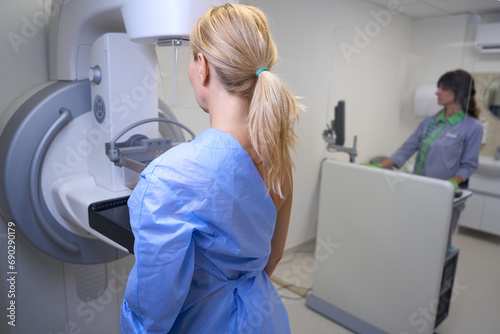 Adult woman is getting screening mammogram in clinic