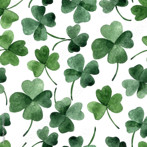 watercolor seamless pattern on the theme of st. patrick's day. green four-leaf clover leaves on a white background. holiday print photo