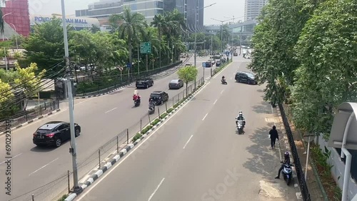 Pondoh Indah Street Situation with car and motorcycle busy highway metro landscape capital asia indonesia photo