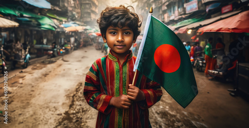 Bangladeshi boy holding Bangladesh flag in Dacca street photo