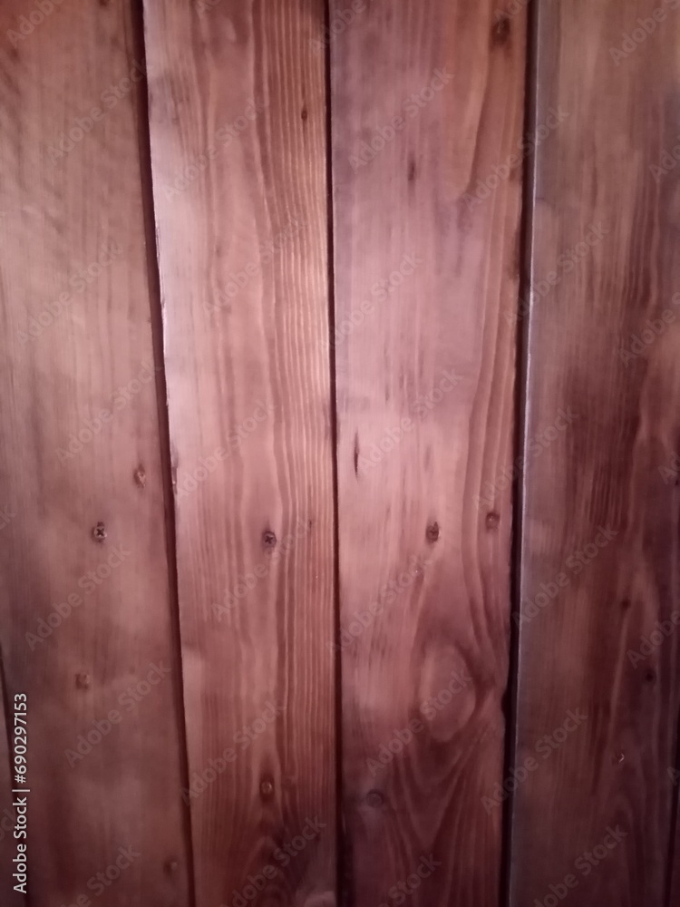 Naklejka premium wood texture background in brown red color. High quality photo. Can used for texture backdrop, background for floor goods, wallpapers, long vertical planks.
