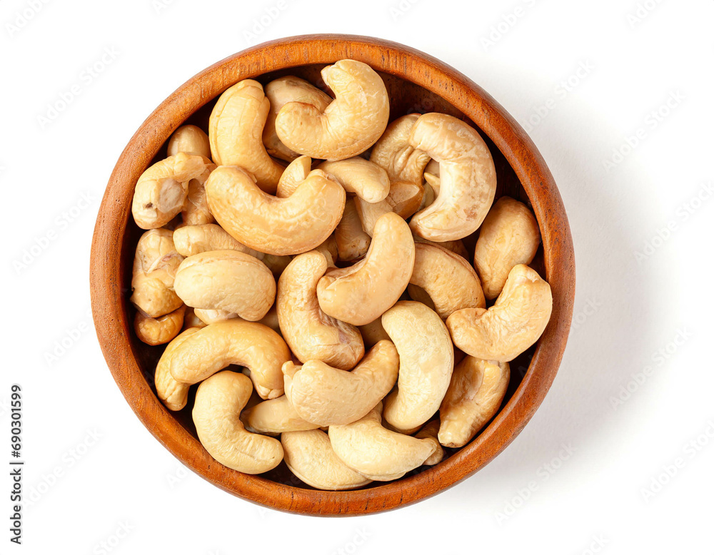 Wooden bowl with cashew nuts isolated on white background, cut out, top view Wooden bowl with cashew nuts isolated on white background, cut out, top view