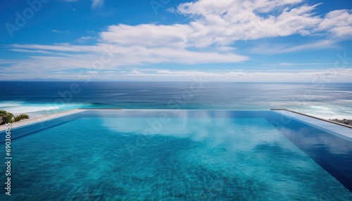 A Stunning Ocean View from a Spacious Swimming Pool