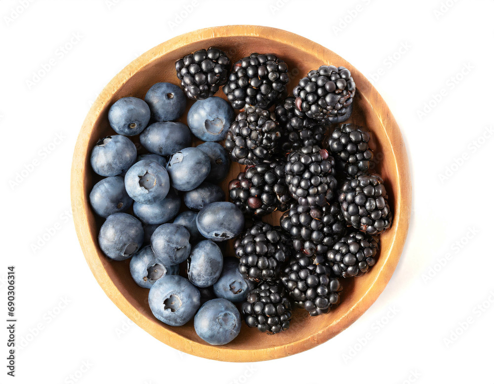 Wooden bowl with blueberries and blackberries isolated on white background, top view Wooden bowl with blueberries and blackberries isolated on white background, top view