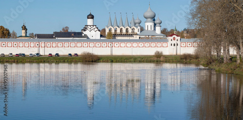 Sunny October day at the ancient Tikhvin Assumption Monastery. View from the Tabory pond. Leningrad region