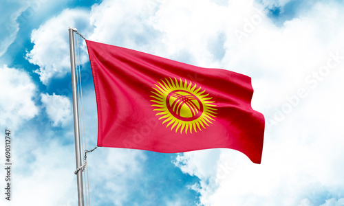 Kyrgyzstan flag waving on sky background. 3D Rendering