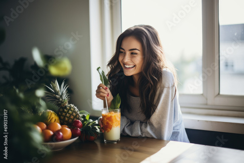 A Healthy young woman enjoying a fresh fruit smoothie at home. Beautiful woman preparing to cook a detox meal in the kitchen at home for vitamin C health. Healthy drinks