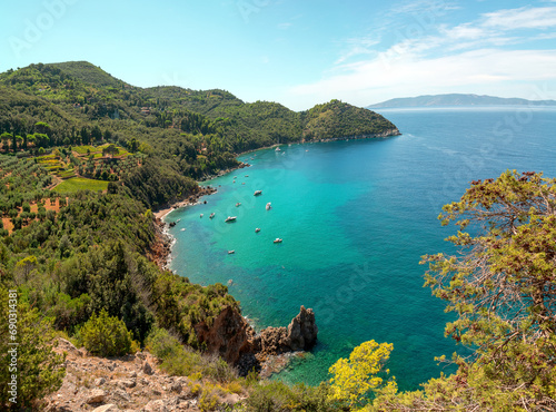 Beautiful mediterranean italian landscape. Aerial view from the panoramic road of the commune of Monte Argentario to the beach of Cala grande. Turquoise water of the Tyrrhenian Sea. Tuscany, Grosseto. © leesle
