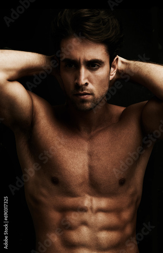 Abs, black background or portrait of man for workout, training or exercise in studio for fitness. Model, dark shadow or ripped male person with healthy body, six pack or stomach for wellness in Italy