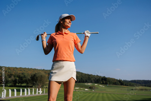 Fototapeta Naklejka Na Ścianę i Meble -  Graceful Swing: Woman Enjoying Golf