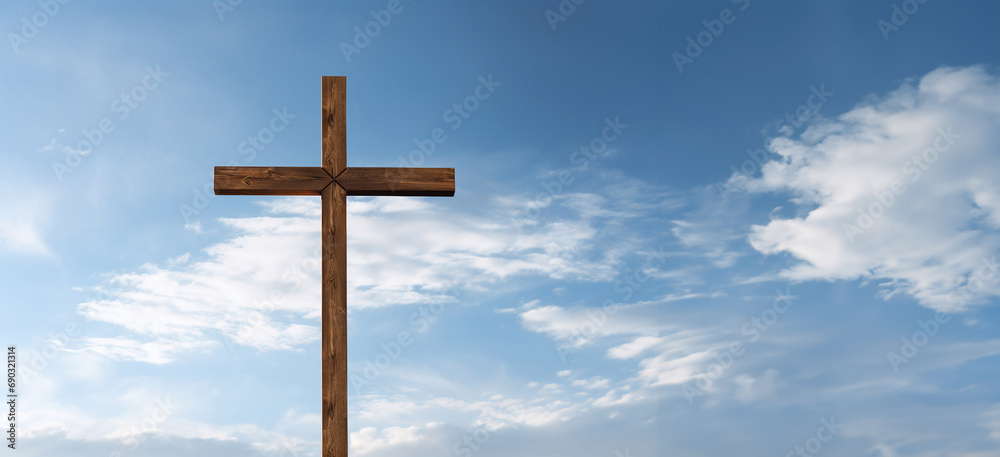 Wooden cross on blue sky background. Christian concept.