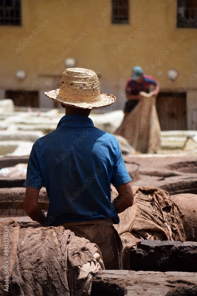 Working man in the Chouara tannery in Fez