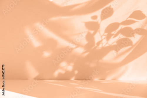 Tropical leaf shadow blank background composition for product presentation. Beautiful trendy peach fuzz color background. photo