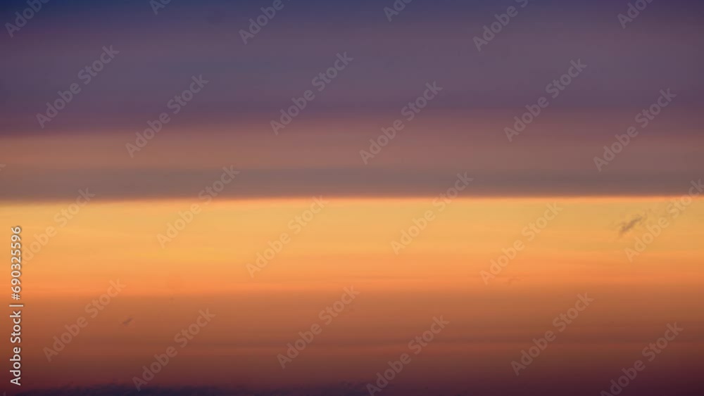 Sunset sky background, time lapse. Beautiful sunset sky with orange and purple colors. Sunset sky background, time lapse. Beautiful sunset sky with orange and purple colors.