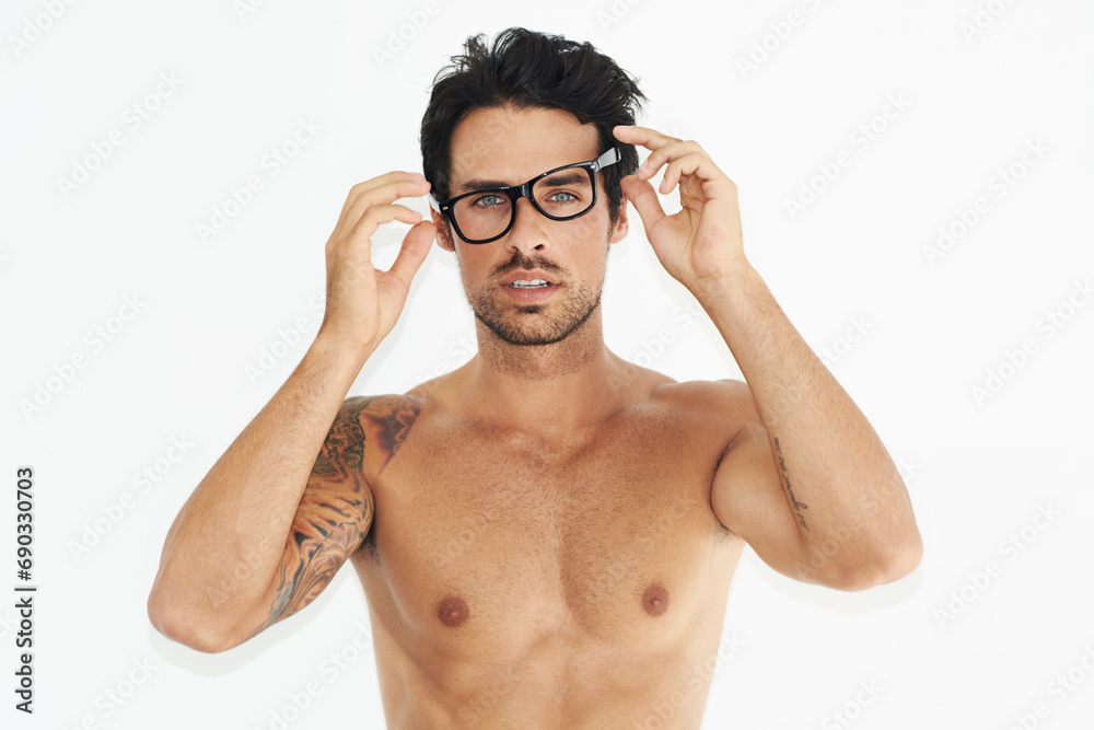 Portrait, body and glasses with an awkward man in studio isolated on a white background to wake up. Vision, eyewear and a shirtless young person looking confused, unsure or surprised in the morning Portrait, body and glasses with an awkward man in studio isolated on a white background to wake up. Vision, eyewear and a shirtless young person looking confused, unsure or surprised in the morning