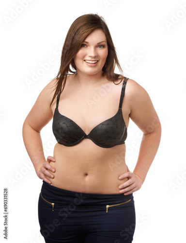 Portrait, happy and bra with a plus size woman in studio isolated on a white background for body positivity. Beauty, smile and a confident young model looking natural in her underwear for wellness