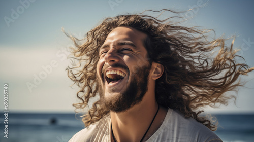 Joyous Seaside Laughter: White Man with Windblown Hair by the Ocean