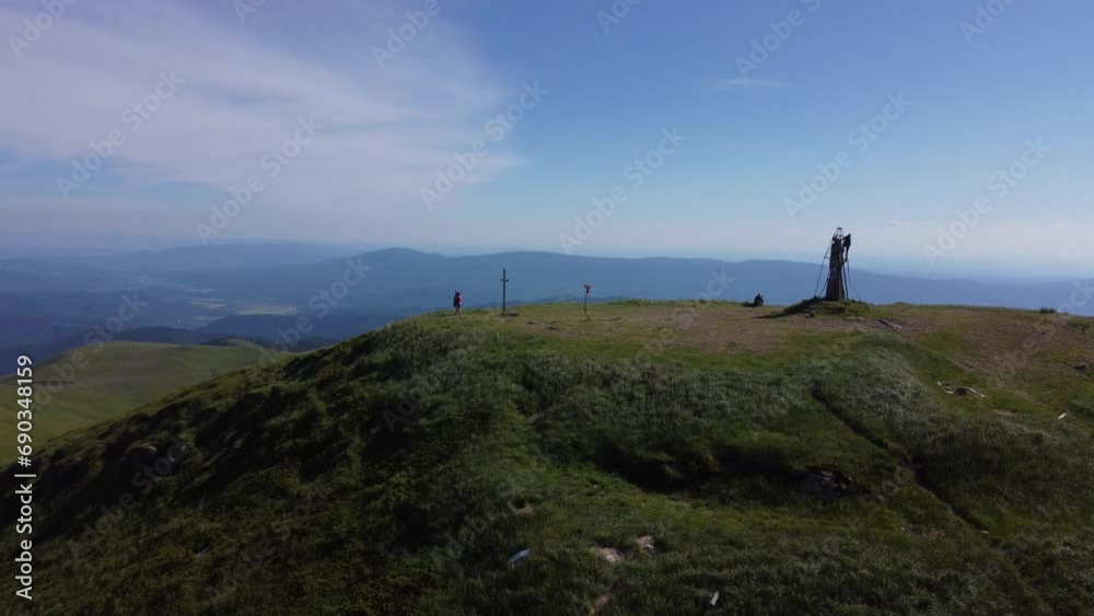 Drone view of the monument and crosses at the top of the mountain. Shots of the summer Carpathians, filming in a semicircle. Drone view of the monument and crosses at the top of the mountain. Shots of the summer Carpathians, filming in a semicircle.
