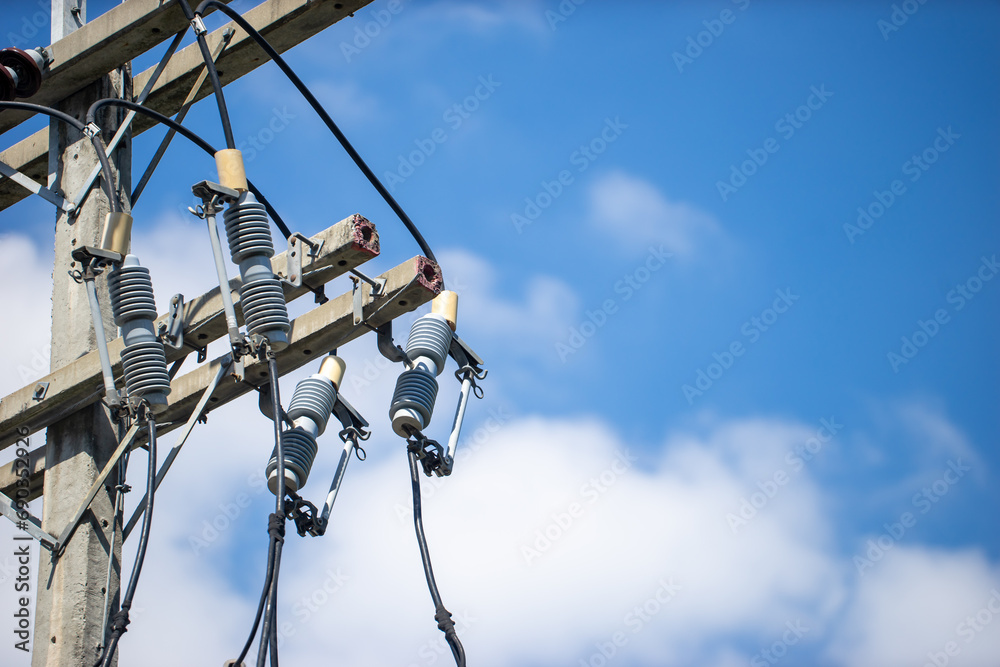 An electrical pole that shows the disorder in the arrangement of the cables. An electrical pole that shows the disorder in the arrangement of the cables.