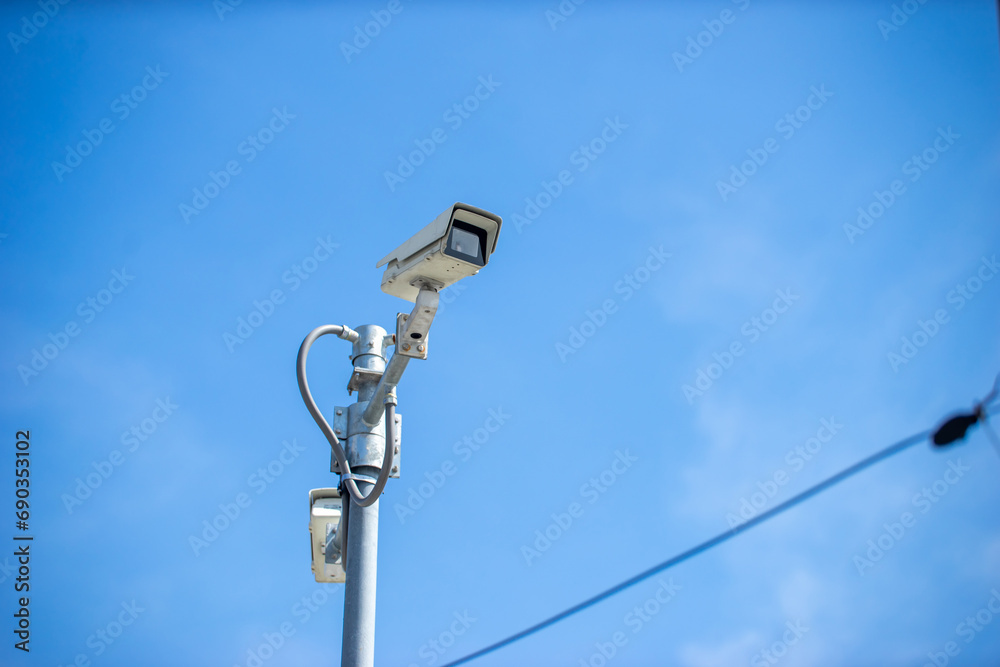 A stock photo of a CCTV (Closed Circuit Television) typically features an image or illustration related to surveillance, security, or monitoring systems. This type of image could include