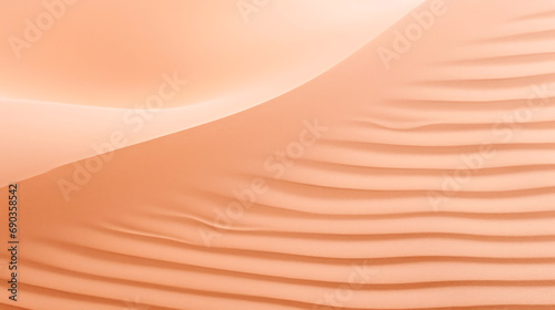 An abstract photo of a sand dune in the desert. Monochrome peach fuzz background.