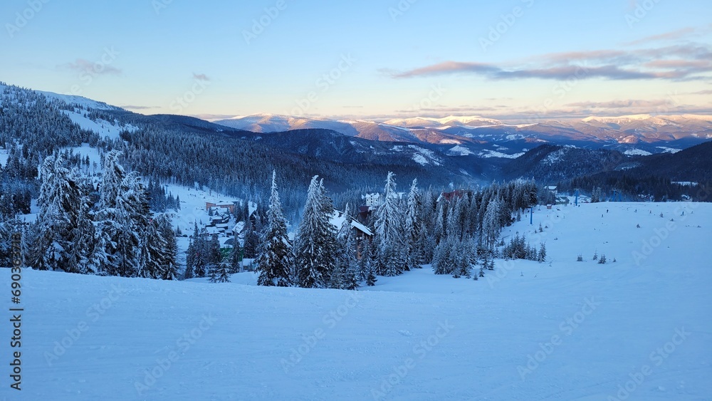 Beautiful landscape with snow-capped mountains. Ski resort in the morning. Dawn in the mountains. Drahobrat, Zakarpattia Oblast, Ukraine