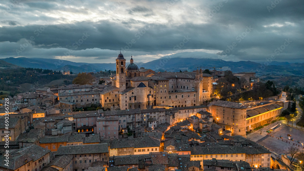 Italy, 14 December 2023 - Aerial view of the medieval village of Urbino, a UNESCO heritage site in the province of Pesaro and Urbino in the Marche region. Here you can breathe an air of past history - obrazy, fototapety, plakaty 