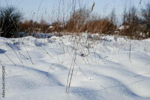 Snow-covered streets and fields on a sunny, frosty day