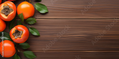 Top view of fresh sweet persimmons kaki with leaves on wooden table background for Chinese lunar new year. ai generative
