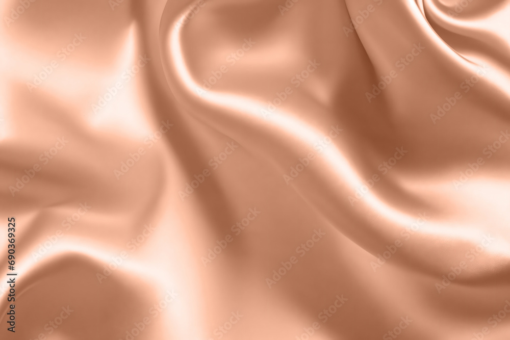 Abstract background, folds of silk fabric in peach fuzz color. Abstract background, folds of silk fabric in peach fuzz color.