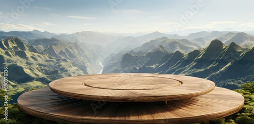 a wooden circular table overlooking some grassy mountains
