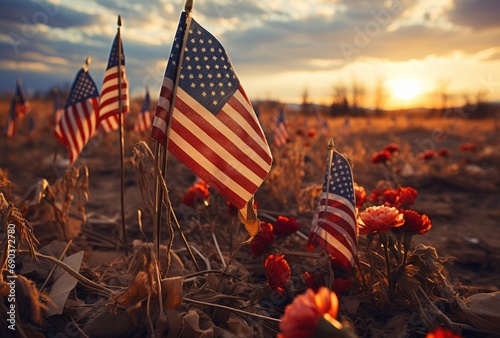 American flags in a cemetery at sunset photo