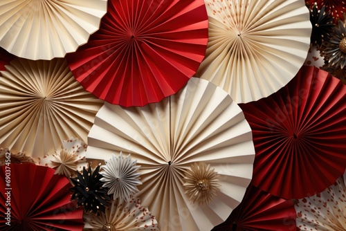paper fans with red, ivory and gold patterns