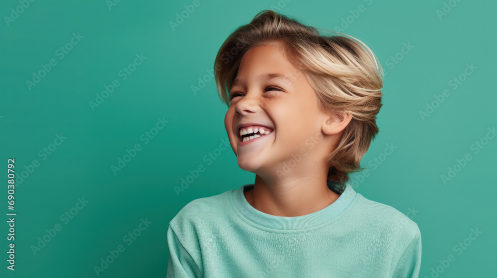 Happy young caucasian boy in casual outfit isolated over green background Happy young caucasian boy in casual outfit isolated over green background