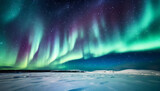 Aurora borealis or northern lights with starry glowing in the night sky and snowed hill.