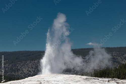 Old Faithful geyser in Yellowstone park