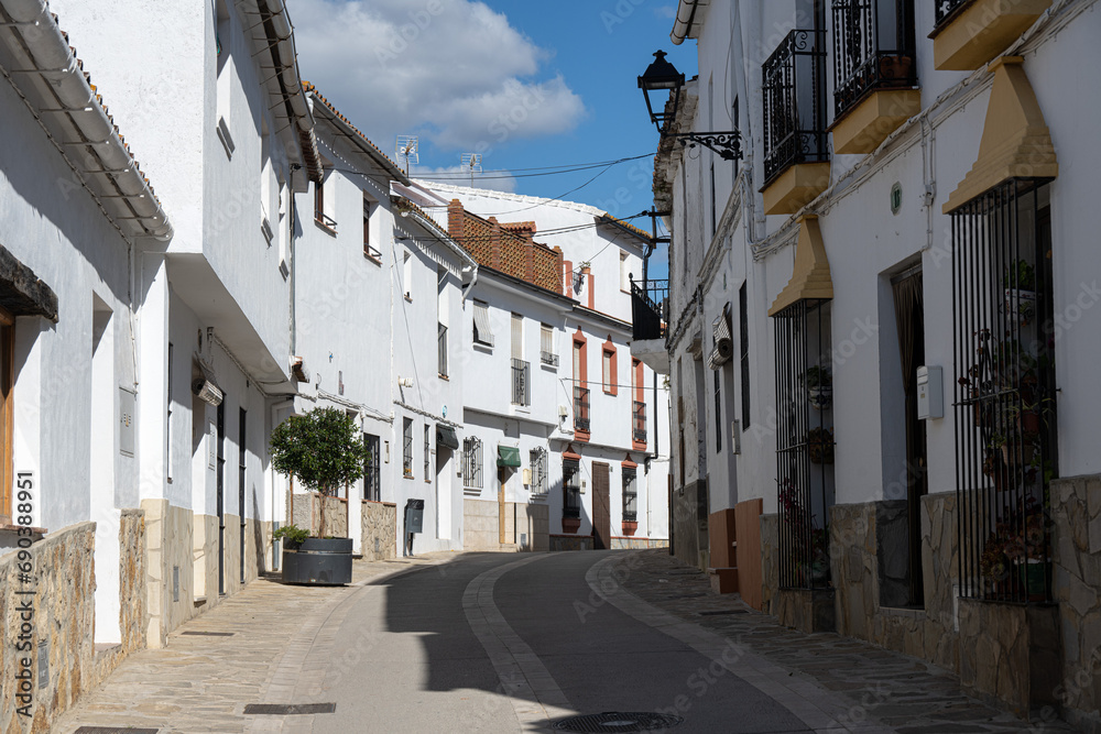 A quaint Spanish street with white washed buildings in the city of Gaucin, Andalucia