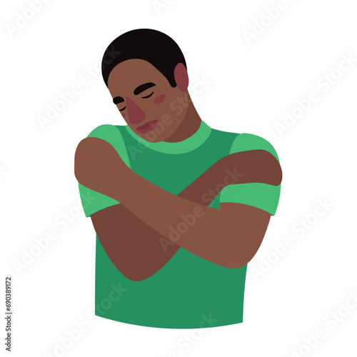 African-American man hugging himself on white background