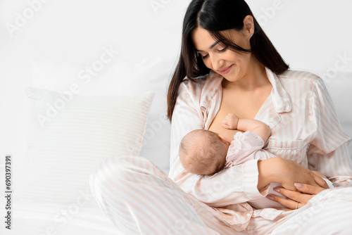 Happy mother breastfeeding ...