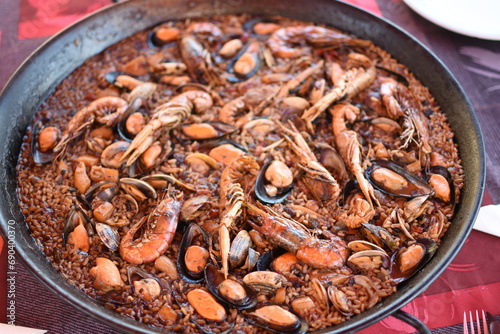 Typical Spanish food: paella in summer.